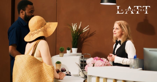 visitors checking into hotel